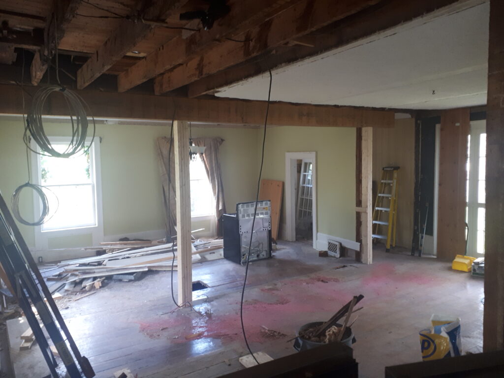open concept restructuring to combine a kitchen dining room living room into a great room
