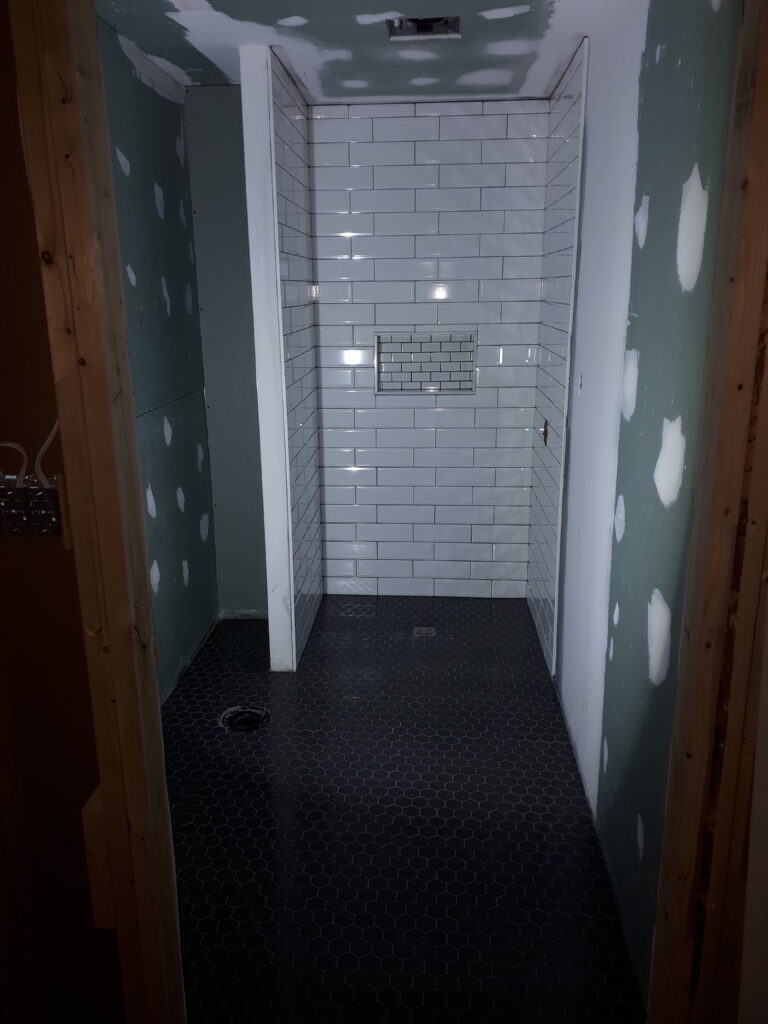 Shawn Maclean construction installing subway tile