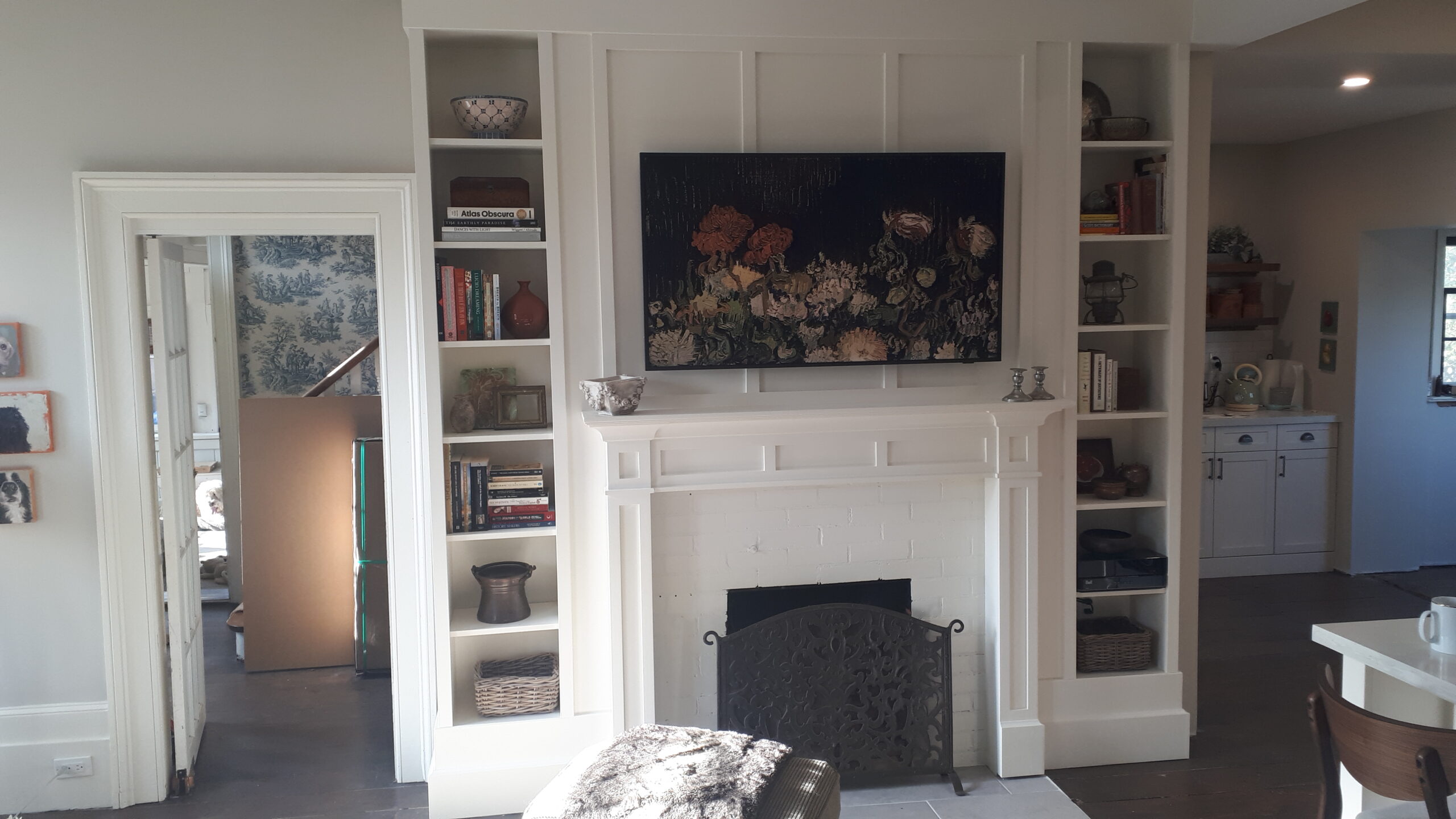custom built in fireplace surround with bookshelves